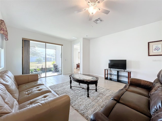 tiled living room featuring ceiling fan