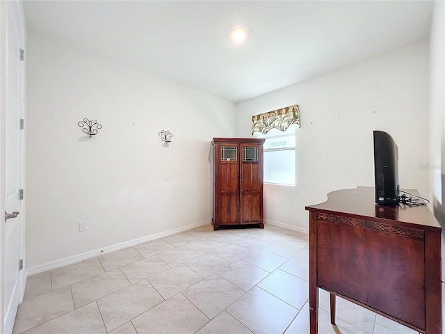 unfurnished office with light tile patterned floors