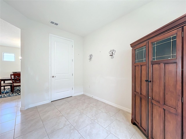 spare room with light tile patterned floors