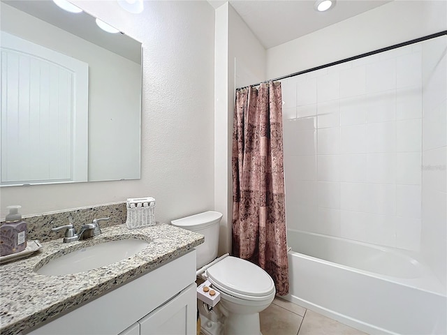 full bathroom featuring tile patterned floors, toilet, vanity, and shower / bath combo