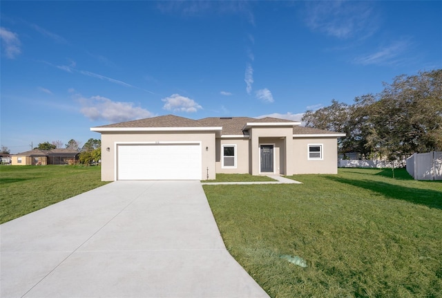 view of front of property with a garage and a front yard