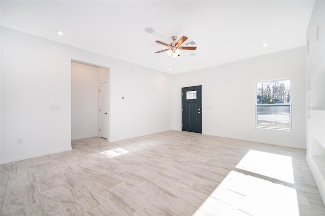 spare room with ceiling fan