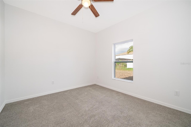 carpeted empty room with ceiling fan