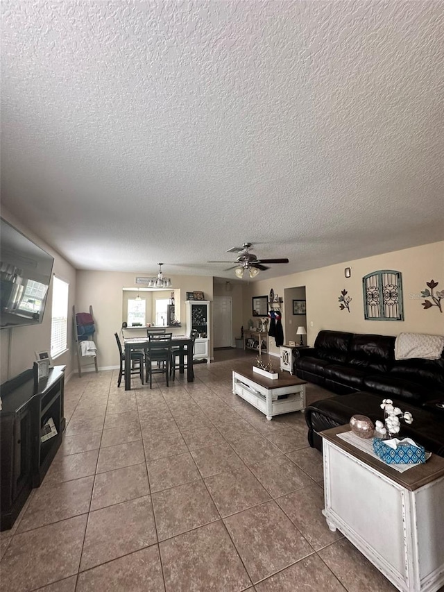 living room featuring tile patterned flooring and a textured ceiling