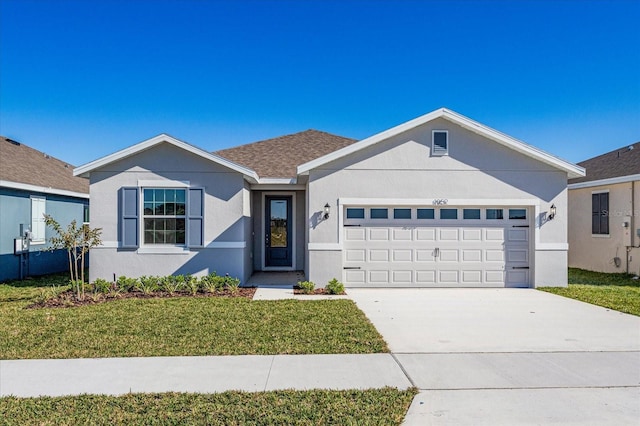 ranch-style home featuring a garage and a front yard