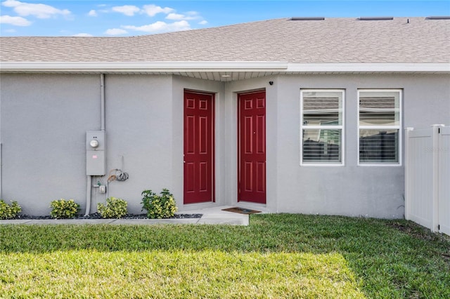 entrance to property with a yard