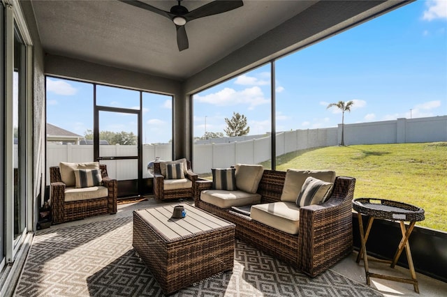 sunroom featuring ceiling fan