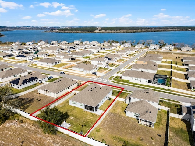 bird's eye view with a water view