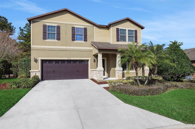 view of front facade featuring a garage and a front lawn