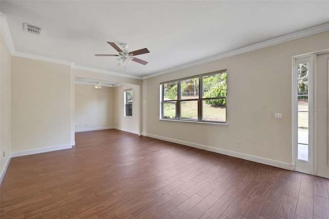 unfurnished room with ornamental molding, dark wood-type flooring, a wealth of natural light, and ceiling fan