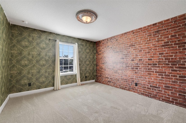 unfurnished room featuring a textured ceiling and carpet flooring