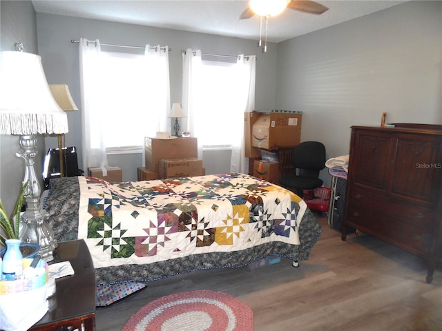 bedroom featuring ceiling fan and wood-type flooring