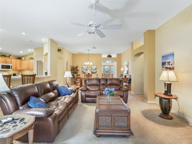 living room with baseboards, a ceiling fan, light colored carpet, vaulted ceiling, and recessed lighting