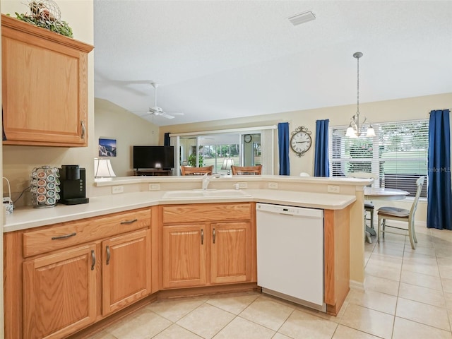 kitchen featuring a sink, light tile patterned floors, light countertops, and dishwasher