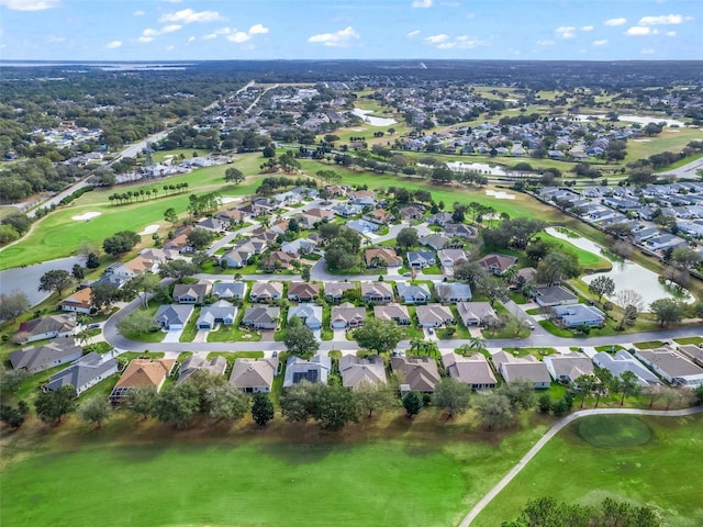 drone / aerial view with a residential view and a water view