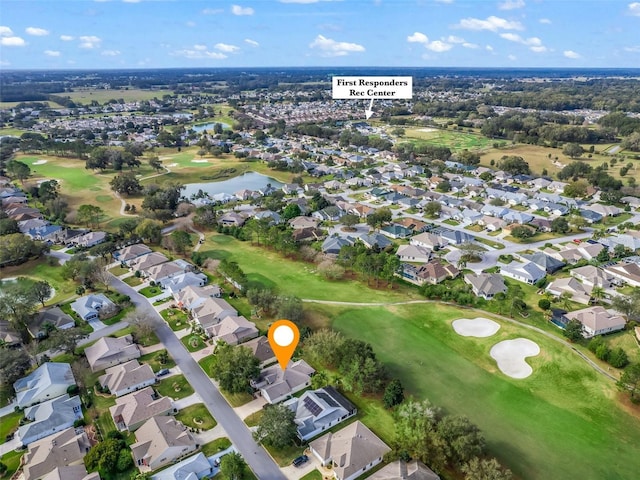 aerial view featuring a water view, a residential view, and golf course view