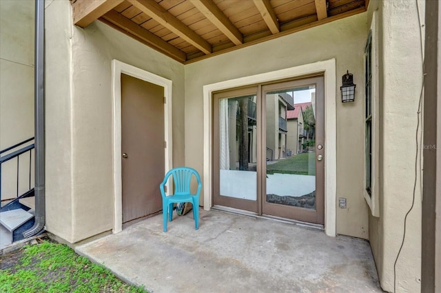 entrance to property featuring a patio