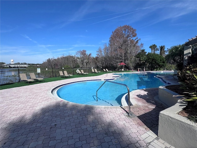 view of swimming pool with a patio area