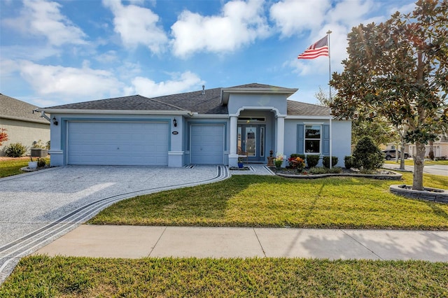 view of front of property featuring a garage, central air condition unit, and a front lawn