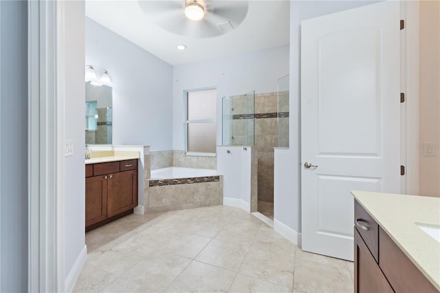 bathroom featuring vanity, tile patterned floors, plus walk in shower, and ceiling fan