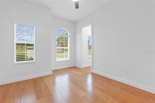 unfurnished room with light hardwood / wood-style flooring and ceiling fan