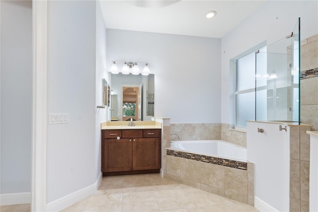 bathroom featuring tile patterned floors, vanity, and independent shower and bath