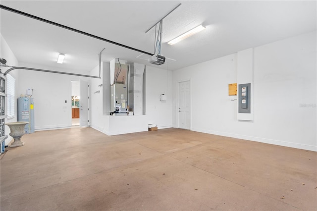 garage with a garage door opener, electric panel, and water heater