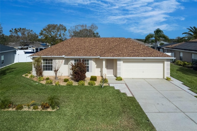 ranch-style home with a garage and a front lawn