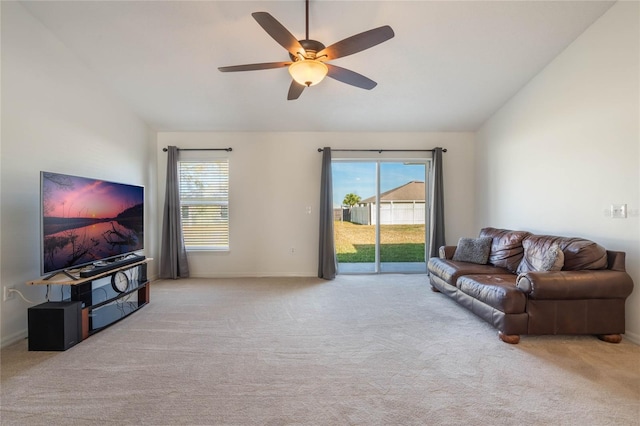 carpeted living room featuring lofted ceiling and ceiling fan