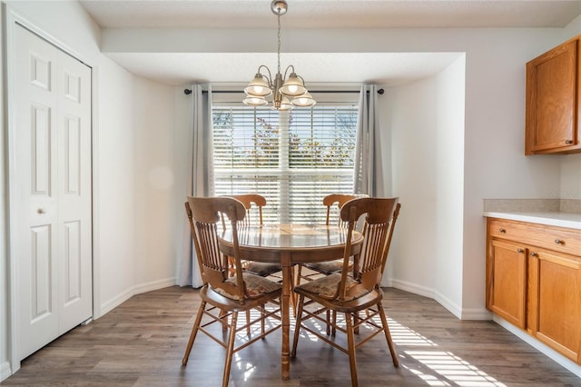 dining room featuring a notable chandelier and wood-type flooring