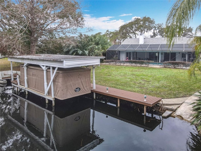 exterior space featuring a lawn, a boat dock, a water view, and glass enclosure