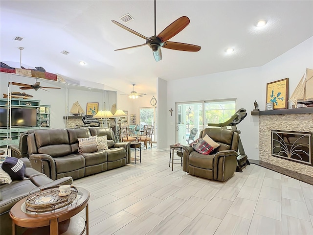 living room featuring vaulted ceiling and ceiling fan