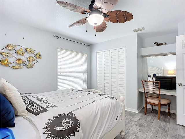 bedroom featuring light hardwood / wood-style flooring, a closet, and ceiling fan