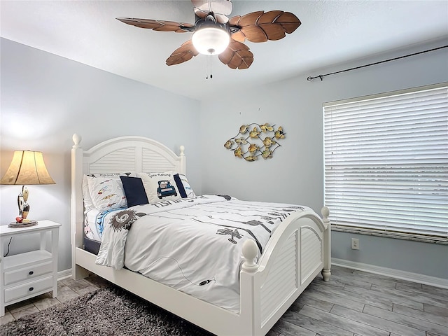 bedroom featuring ceiling fan and light wood-type flooring