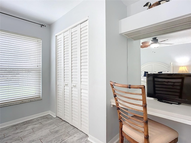 interior space with light hardwood / wood-style floors and ceiling fan