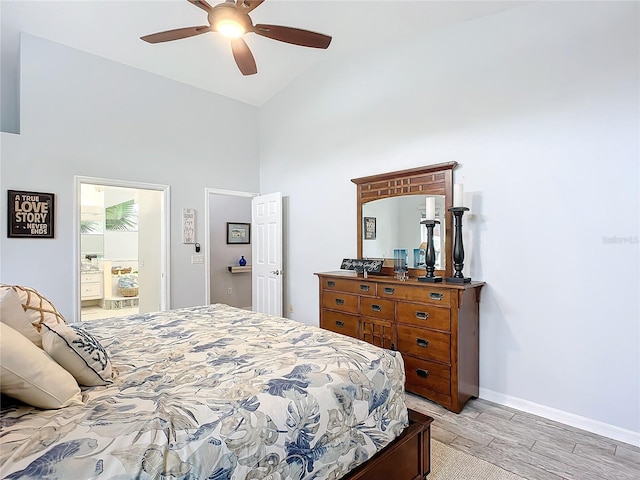 bedroom with ceiling fan, high vaulted ceiling, and light wood-type flooring