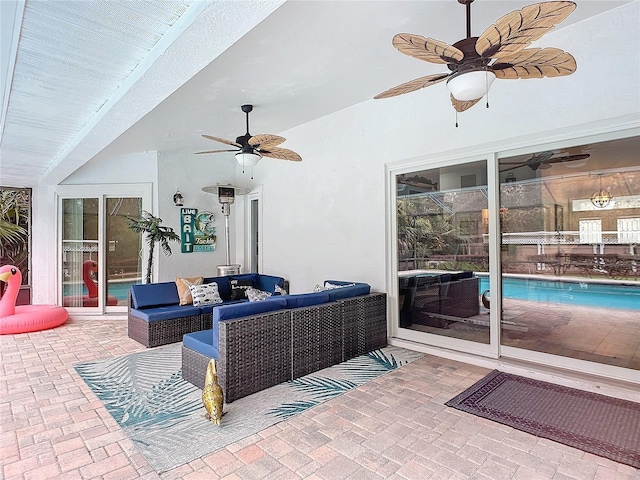 view of patio with outdoor lounge area and ceiling fan