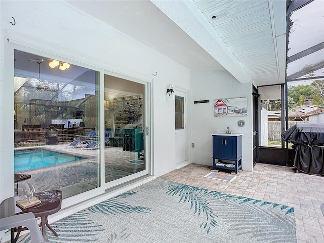 sunroom featuring sink