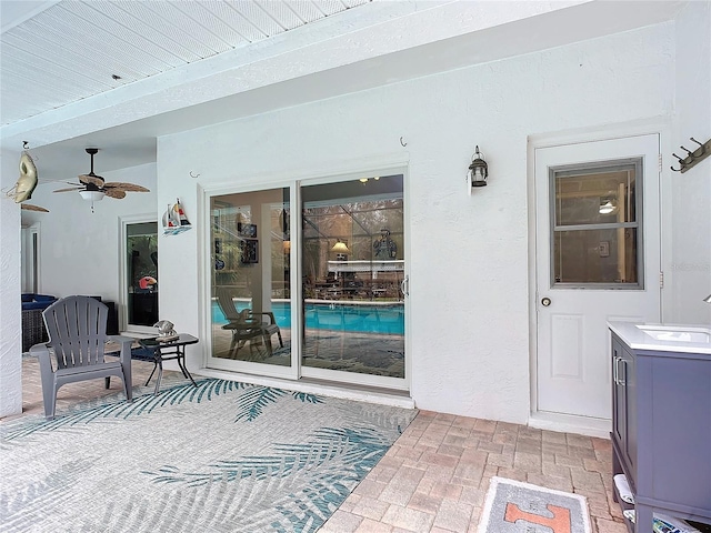 view of patio / terrace with sink and ceiling fan