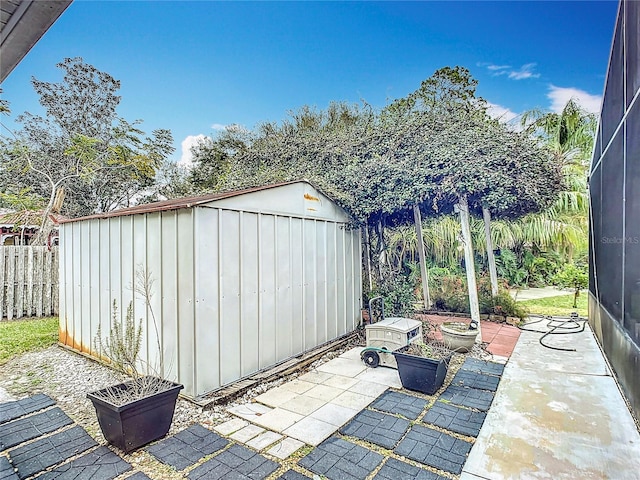 view of patio with a storage shed