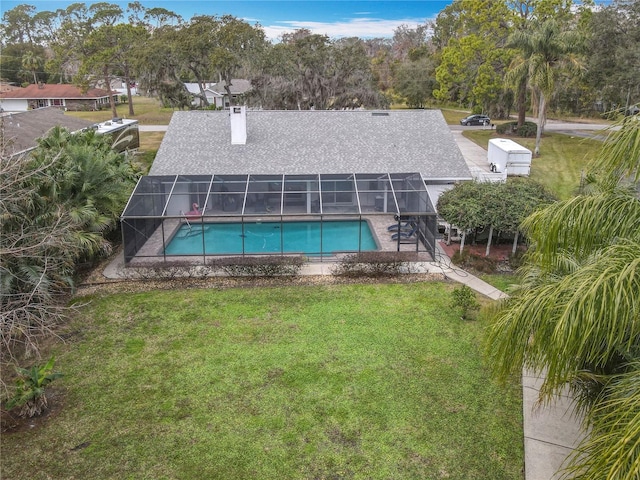 view of pool featuring a patio, a lanai, and a lawn