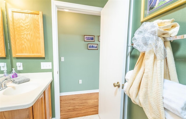 bathroom featuring vanity and baseboards