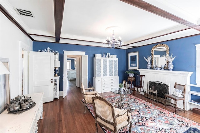 living room with dark wood-type flooring, an inviting chandelier, and beam ceiling