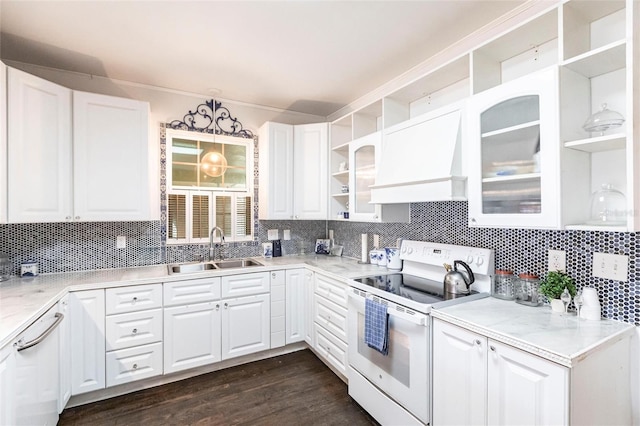 kitchen with sink, white electric stove, custom range hood, pendant lighting, and white cabinets