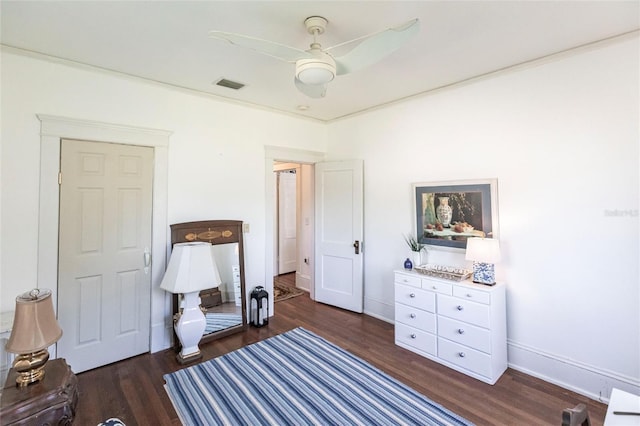 interior space with dark wood-type flooring and ceiling fan