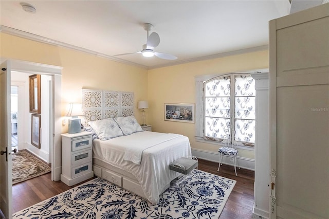 bedroom featuring ornamental molding, dark hardwood / wood-style floors, and ceiling fan