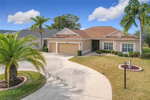 ranch-style home with a garage and a front yard