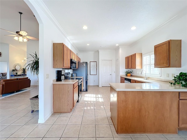 kitchen with light tile patterned flooring, appliances with stainless steel finishes, ornamental molding, and kitchen peninsula