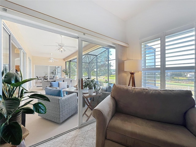 living room with light carpet and ceiling fan