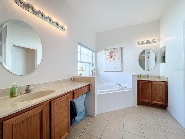 bathroom with tile patterned floors, vanity, and tiled tub